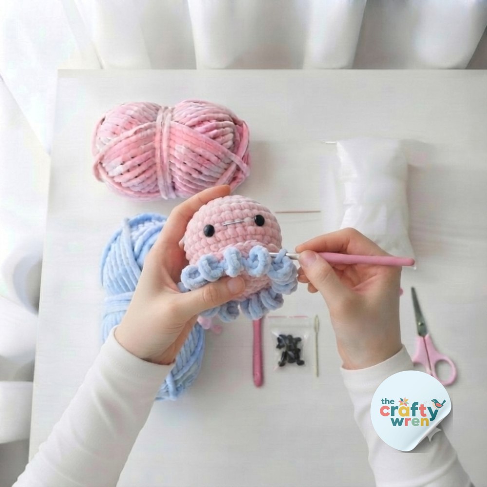 Close-up of the pink-to-blue color change round where eight tentacle stitches begin on the amigurumi octopus crochet pattern