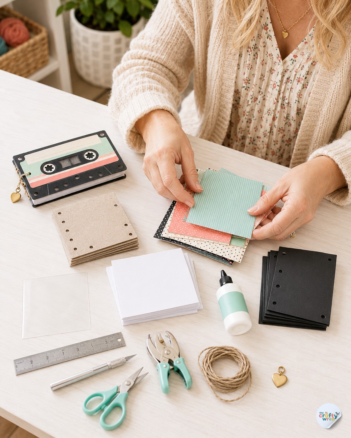 Crafter sorting patterned paper on a table while making a cassette tape flipbook gift