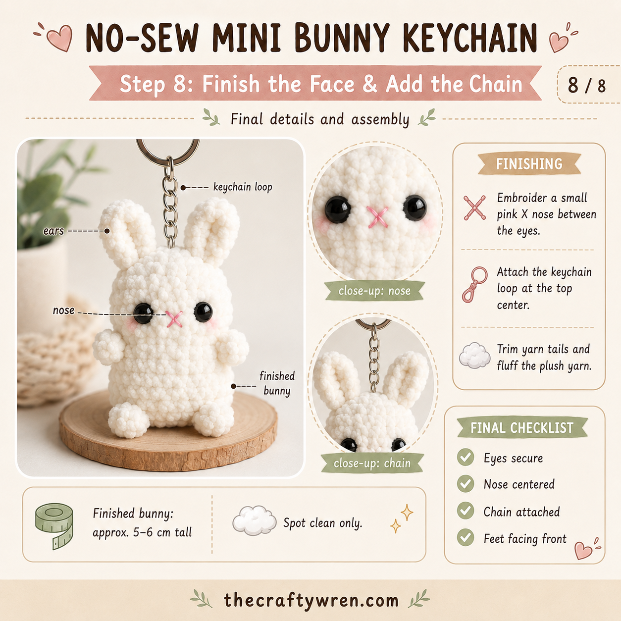 Finished no-sew bunny keychain amigurumi with embroidered nose, safety eyes, and attached keychain chain