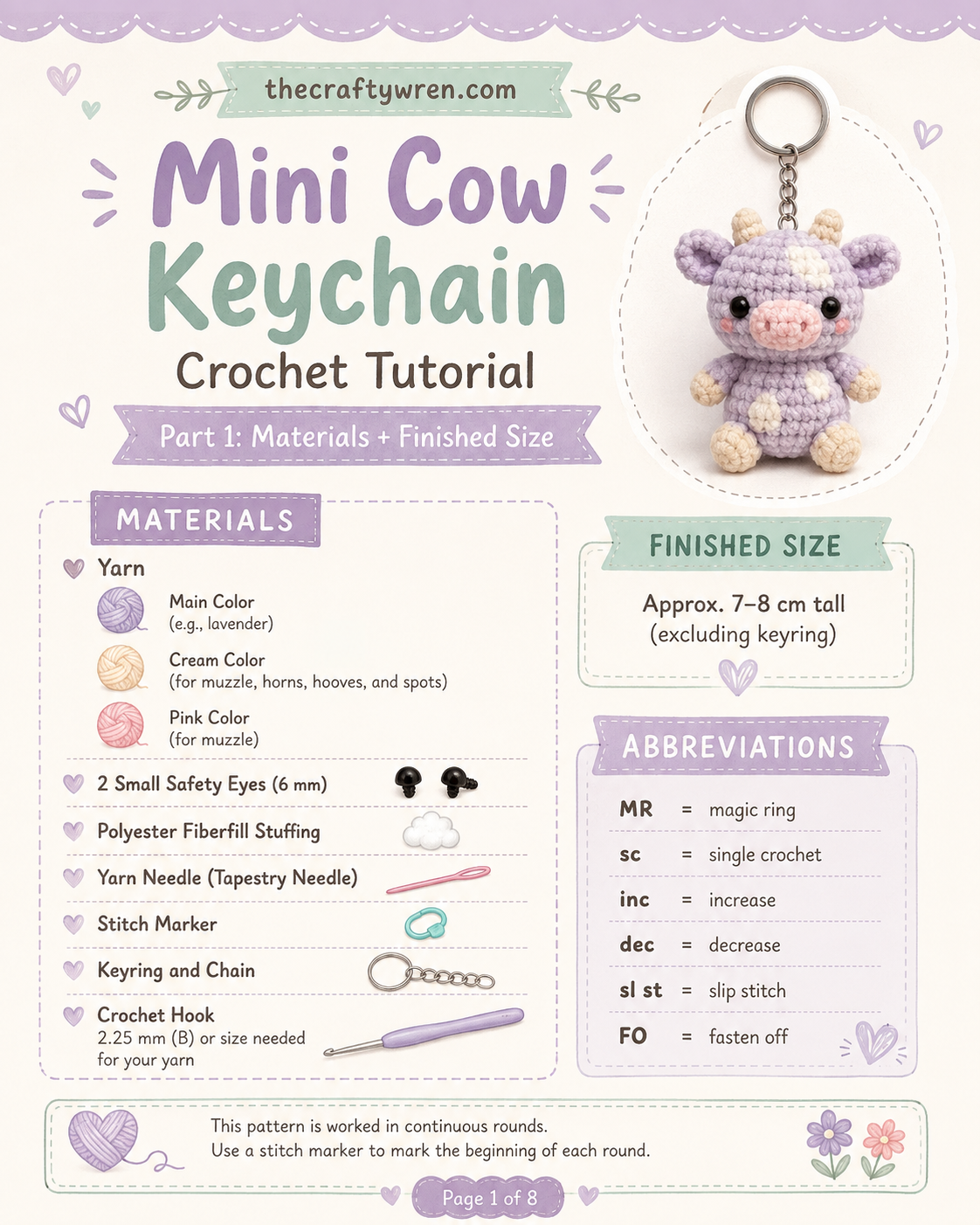 Materials laid out for a pastel cow amigurumi keychain including lavender yarn, hook, and safety eyes