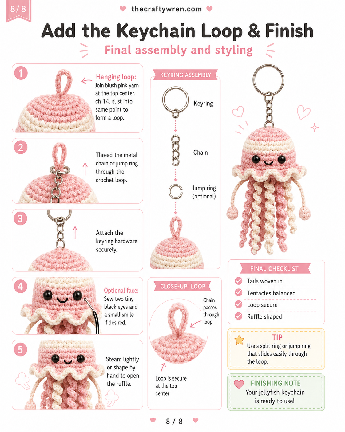 Finished pink jellyfish keychain crochet piece with keyring loop, embroidered face, and curled tentacles