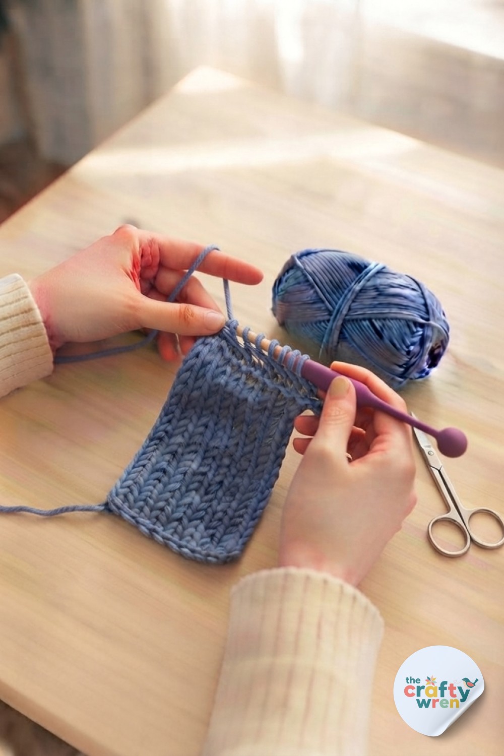 Hands slip stitching to bind off the swatch